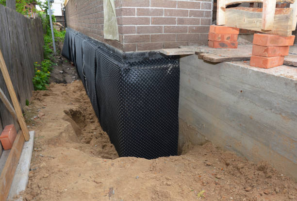 Happy homeowners after waterproofing job in Fountain City